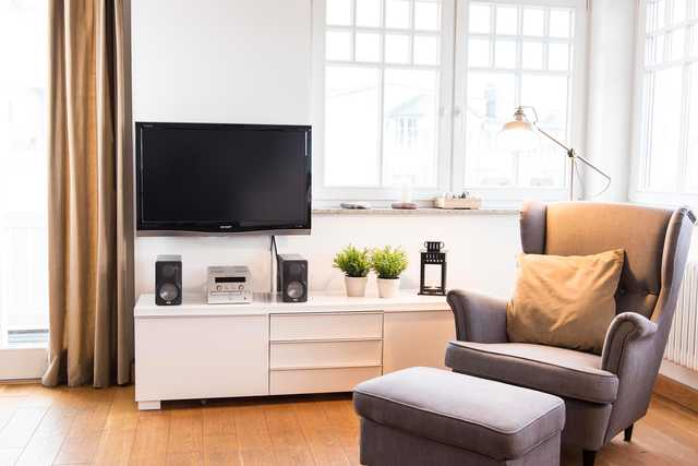 offener Wohnbereich mit Flat-TV, DVD-Player und...