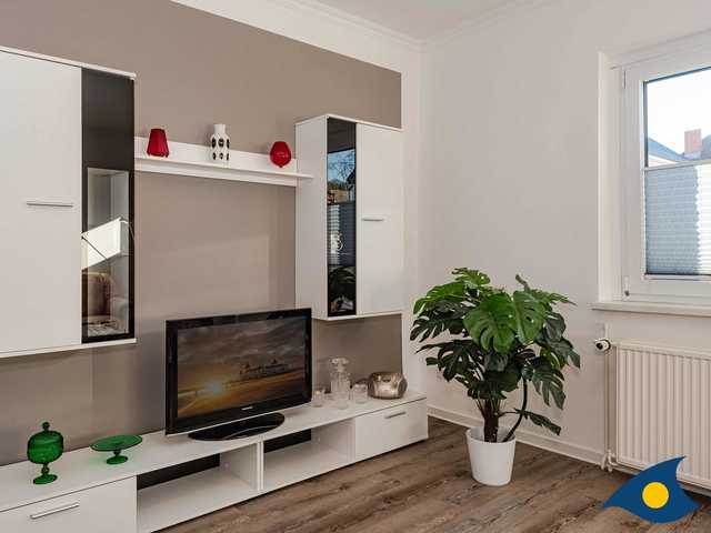 Wohnzimmer mit integrierter Küchenzeile